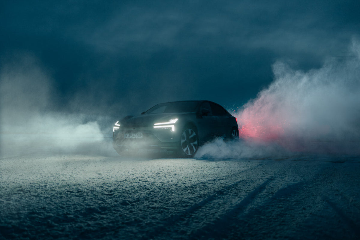 Dark SUV surrounded by heavy fog and smoke at night with red light glowing through, edited with ATMOS Pro Suite atmosphere overlay